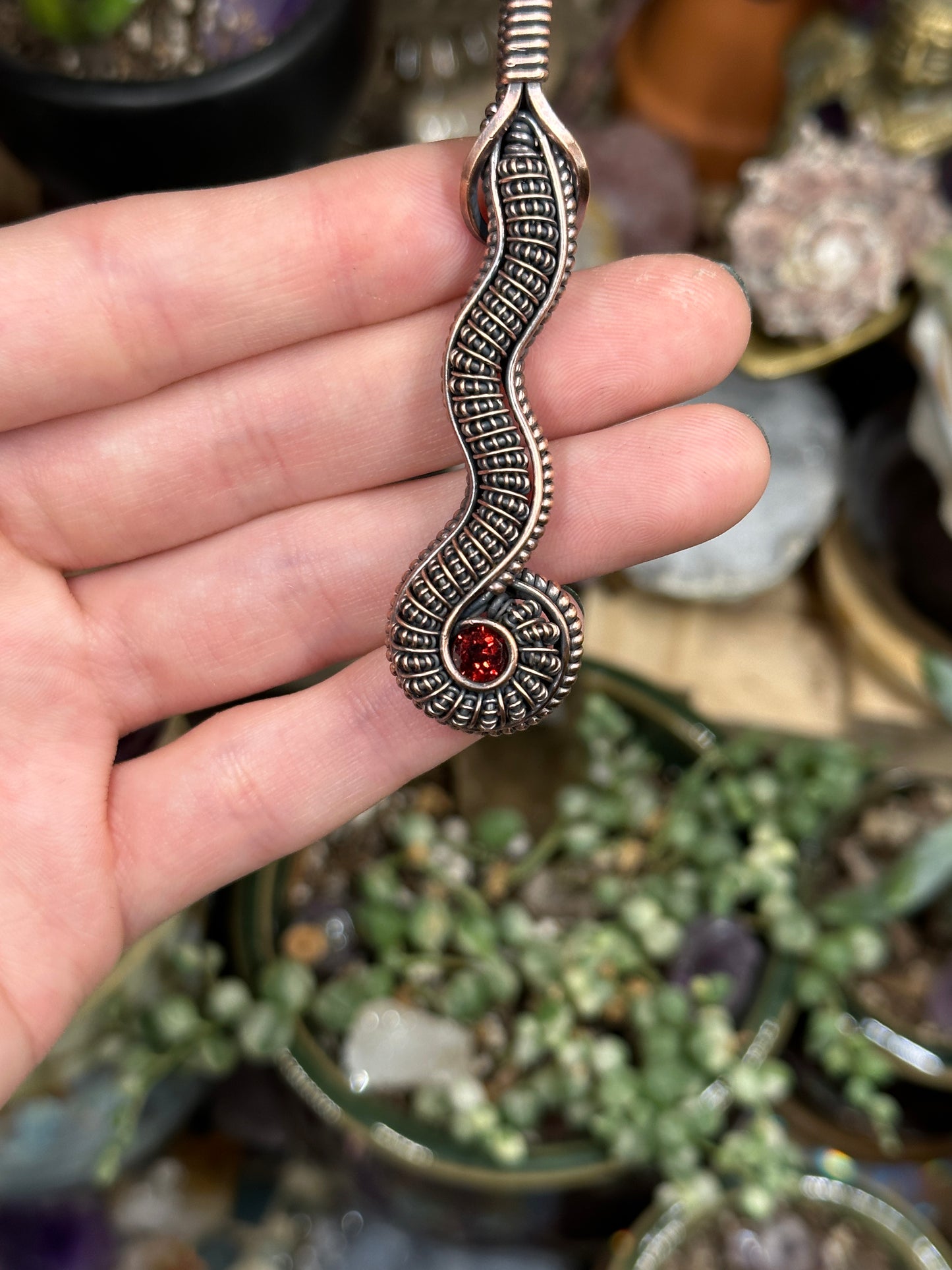 Garnet snake amulet